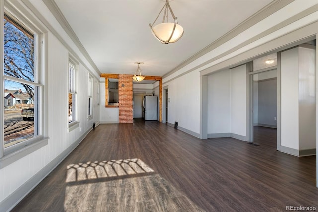 interior space with crown molding and dark wood-type flooring