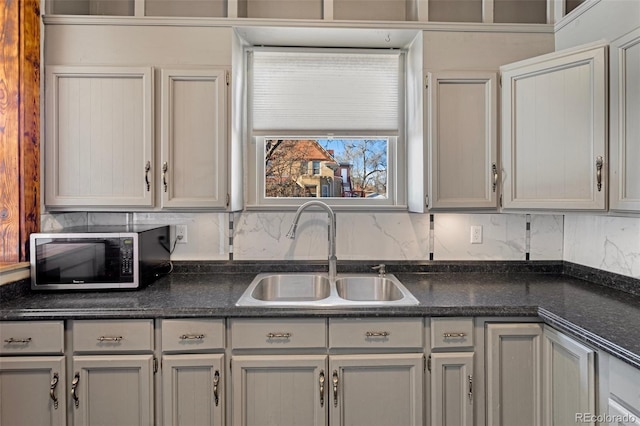 kitchen with tasteful backsplash and sink