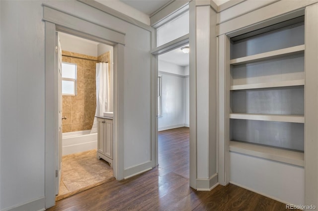 hallway featuring dark wood-type flooring