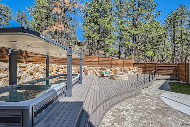 wooden deck featuring a fenced backyard