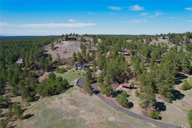 aerial view with a wooded view