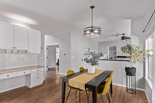 10345 Lions Heart, Lone Tree, CO 80124 - dining space featuring dark wood-style floors, ceiling fan, recessed lighting, a chandelier, and built in desk