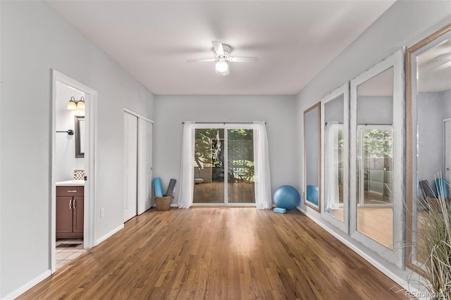 10345 Lions Heart, Lone Tree, CO 80124 - exercise area featuring wood finished floors and ceiling fan