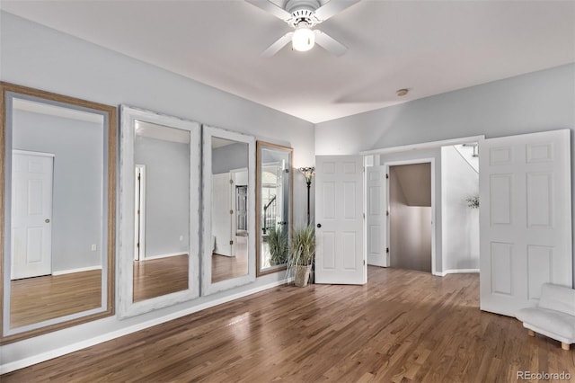 10345 Lions Heart, Lone Tree, CO 80124 - unfurnished bedroom featuring wood finished floors and a ceiling fan
