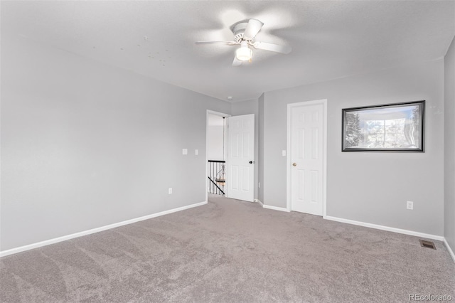 10345 Lions Heart, Lone Tree, CO 80124 - unfurnished bedroom with carpet and a ceiling fan