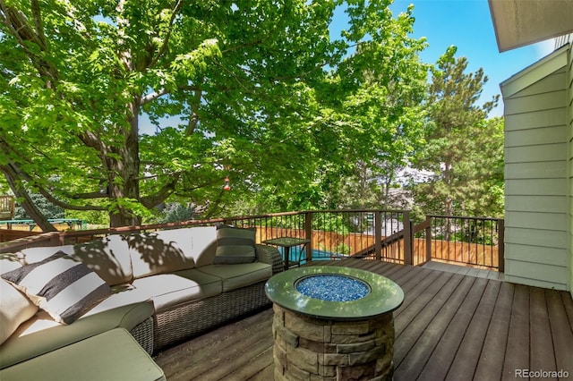 10345 Lions Heart, Lone Tree, CO 80124 - deck with an outdoor living space with a fire pit