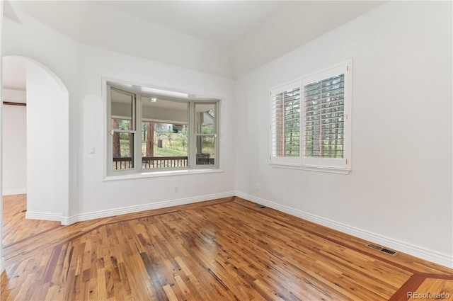 empty room featuring hardwood / wood-style floors