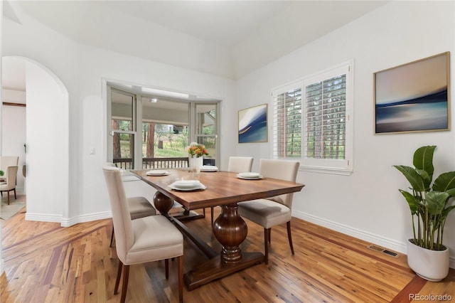 dining area featuring light wood-type flooring