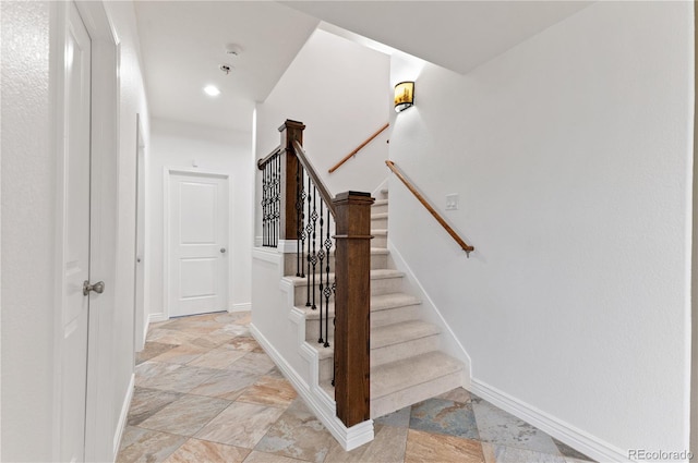 staircase with light tile patterned flooring