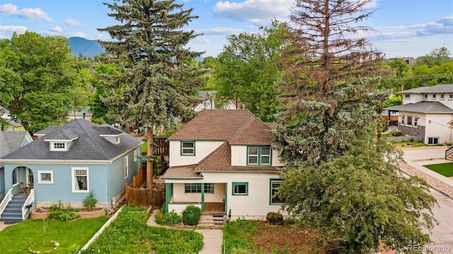 720 N Walnut St, Colorado Springs, CO 80905 - view of front of property featuring a front lawn and a shingled roof