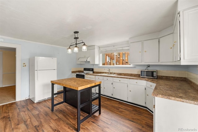 720 N Walnut St, Colorado Springs, CO 80905 - kitchen featuring white appliances, dark wood-type flooring, white cabinets, and pendant lighting
