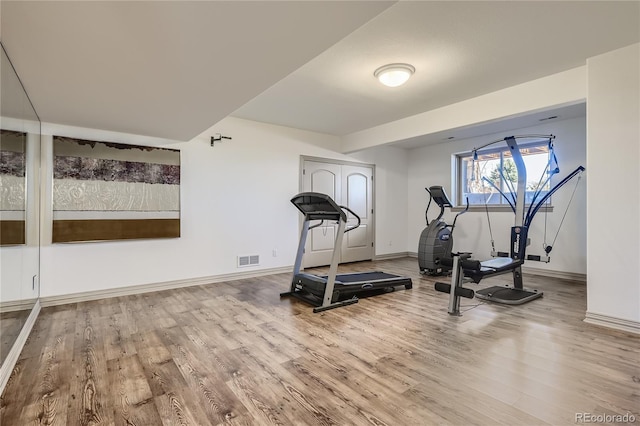 13 Tamarade Dr, Littleton, CO 80127 - exercise area featuring visible vents, baseboards, and wood finished floors