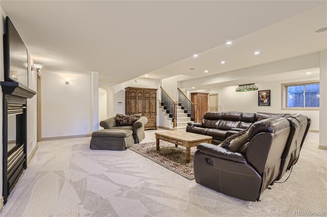 13 Tamarade Dr, Littleton, CO 80127 - living room with arched walkways, stairs, light colored carpet, and recessed lighting