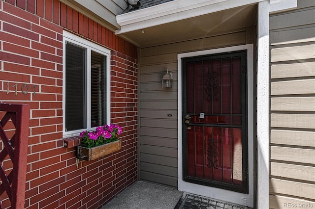 entrance to property with brick siding