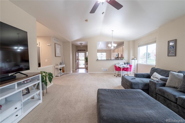 9844 Norfolk St, Commerce City, CO 80022 - living room featuring a chandelier, light carpet, vaulted ceiling, healthy amount of natural light, and ceiling fan