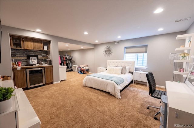 9844 Norfolk St, Commerce City, CO 80022 - bedroom with beverage cooler, light carpet, recessed lighting, and bar area