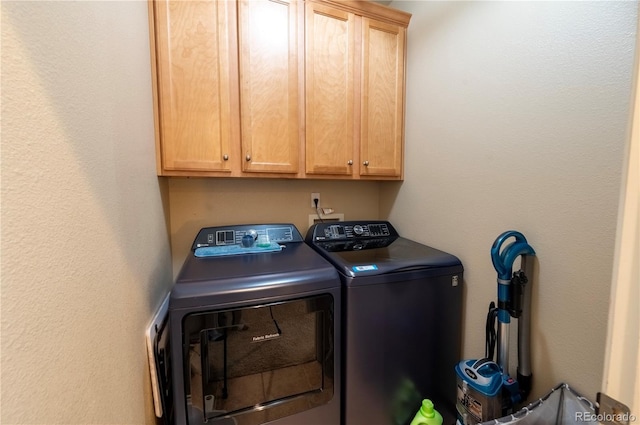 9844 Norfolk St, Commerce City, CO 80022 - laundry area featuring cabinet space and washing machine and clothes dryer