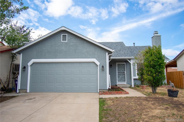 ranch-style home with a garage