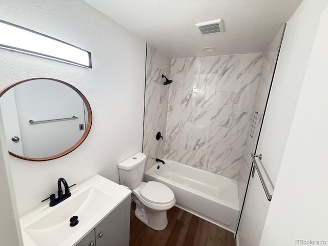 9255 E Lehigh Unit 213, Denver, CO 80237 - bathroom featuring vanity, wood finished floors, and bathtub / shower combination