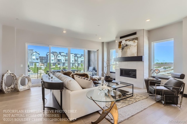 1768 Peak Loop, Broomfield, CO 80023 - living room featuring a fireplace, wood finished floors, and recessed lighting