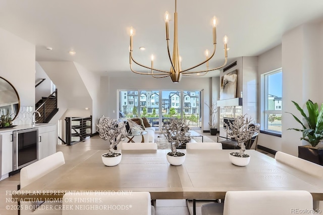 1768 Peak Loop, Broomfield, CO 80023 - dining area featuring a chandelier, wine cooler, healthy amount of natural light, and recessed lighting