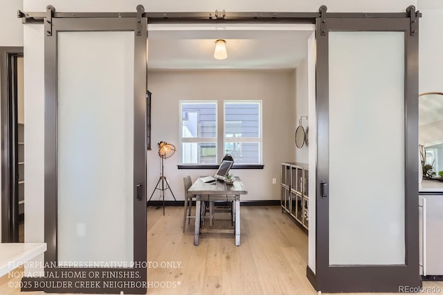 1768 Peak Loop, Broomfield, CO 80023 - dining area featuring a barn door and light wood-style floors