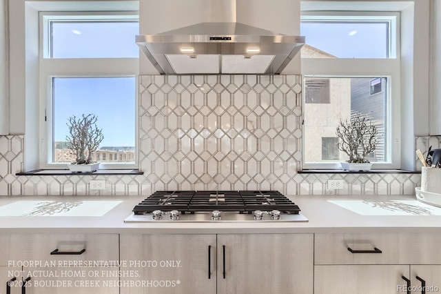 1768 Peak Loop, Broomfield, CO 80023 - kitchen with extractor fan, stainless steel gas stovetop, light countertops, and backsplash