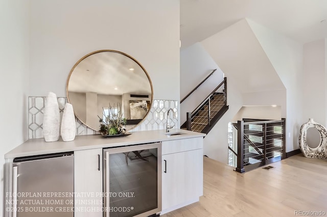1768 Peak Loop, Broomfield, CO 80023 - detailed view of wine cooler, wood finished floors, and fridge