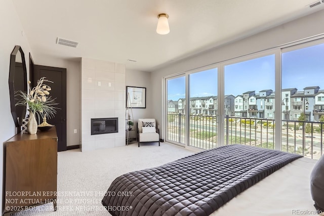 1768 Peak Loop, Broomfield, CO 80023 - carpeted bedroom featuring access to outside, a residential view, and a fireplace