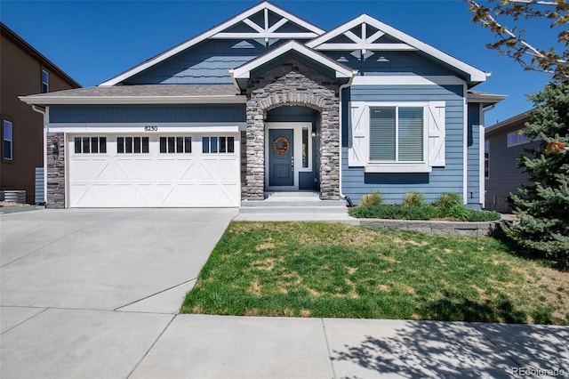 8230 Misty Moon Dr, Colorado Springs, CO 80924 - craftsman-style home featuring stone siding, concrete driveway, a garage, and a front yard