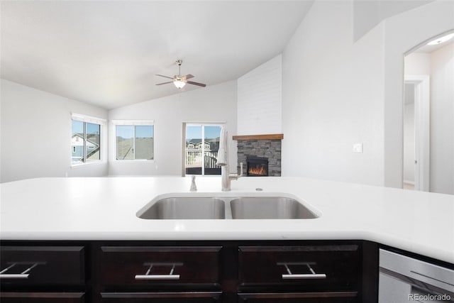8230 Misty Moon Dr, Colorado Springs, CO 80924 - kitchen with ceiling fan, lofted ceiling, light countertops, a sink, and stainless steel dishwasher