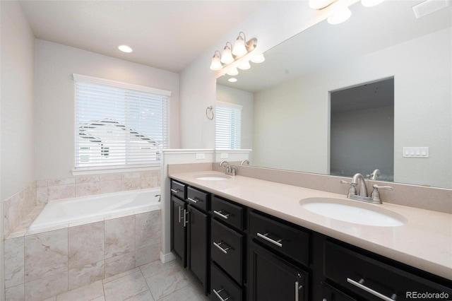 8230 Misty Moon Dr, Colorado Springs, CO 80924 - full bathroom with a garden tub, double vanity, and tile patterned flooring