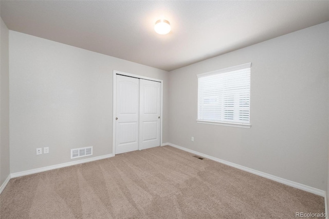 8230 Misty Moon Dr, Colorado Springs, CO 80924 - unfurnished bedroom with carpet flooring, baseboards, and a closet