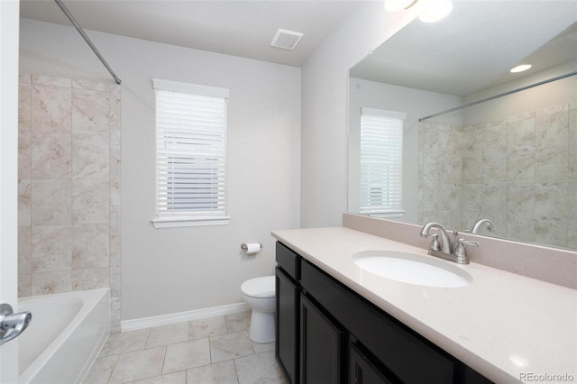 8230 Misty Moon Dr, Colorado Springs, CO 80924 - full bathroom featuring toilet, baseboards, vanity, tile patterned flooring, and shower / bathtub combination