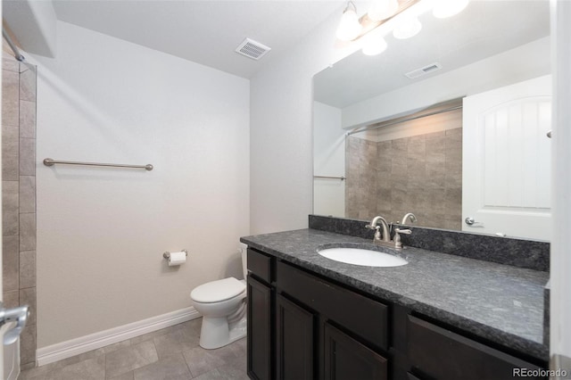 8230 Misty Moon Dr, Colorado Springs, CO 80924 - full bathroom featuring baseboards, toilet, a shower, vanity, and tile patterned floors