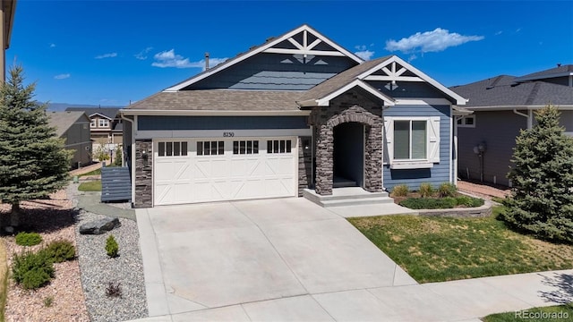 8230 Misty Moon Dr, Colorado Springs, CO 80924 - craftsman house featuring stone siding, driveway, an attached garage, and a shingled roof