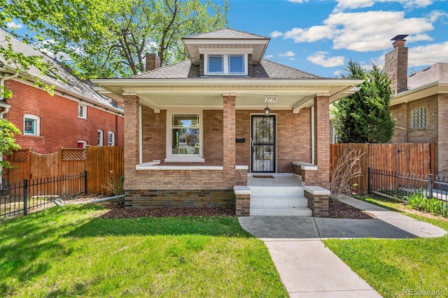 2738 W 38th Ave, Denver, CO 80211 - bungalow-style home featuring covered porch, brick siding, a chimney, and roof with shingles