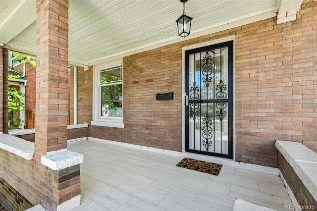 2738 W 38th Ave, Denver, CO 80211 - entrance to property with covered porch and brick siding