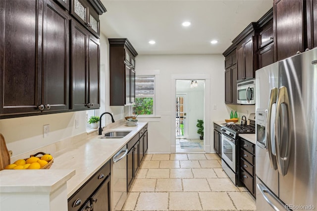 2738 W 38th Ave, Denver, CO 80211 - kitchen featuring appliances with stainless steel finishes, a sink, dark brown cabinetry, recessed lighting, and light countertops