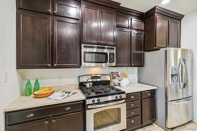 2738 W 38th Ave, Denver, CO 80211 - kitchen with appliances with stainless steel finishes, dark brown cabinets, and light countertops