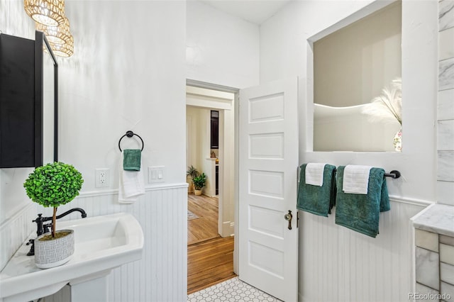 2738 W 38th Ave, Denver, CO 80211 - bathroom with wainscoting and a sink