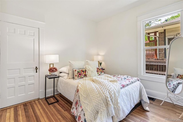 2738 W 38th Ave, Denver, CO 80211 - bedroom featuring wood finished floors and baseboards