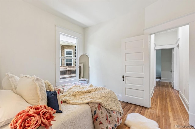 2738 W 38th Ave, Denver, CO 80211 - bedroom featuring light wood-style floors and baseboards