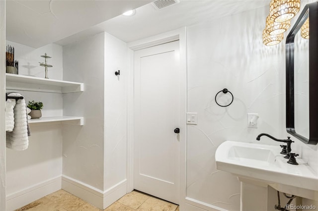 2738 W 38th Ave, Denver, CO 80211 - bathroom featuring baseboards and tile patterned floors