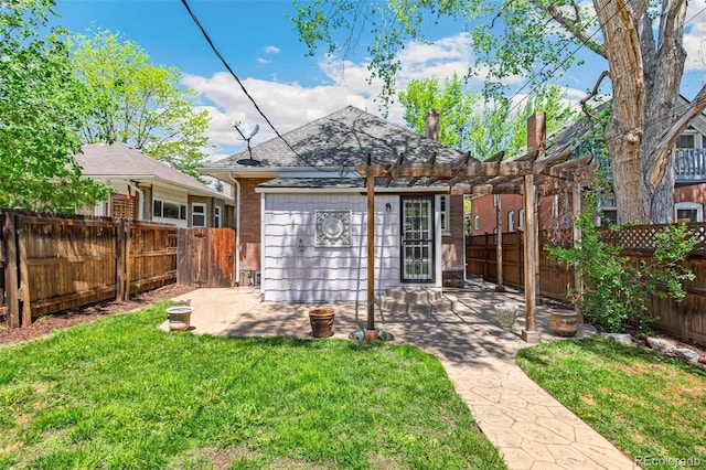 2738 W 38th Ave, Denver, CO 80211 - back of property with a pergola, a patio, a shingled roof, and brick siding