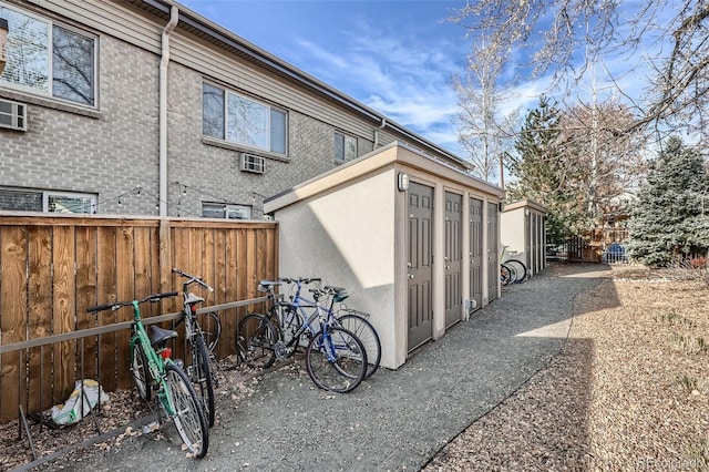 view of outbuilding with fence