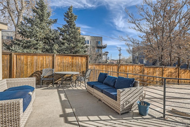 view of patio with an outdoor hangout area and a fenced backyard