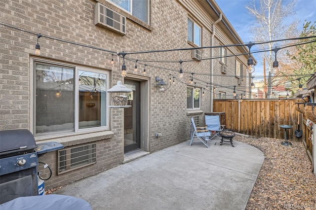 view of patio with fence and area for grilling