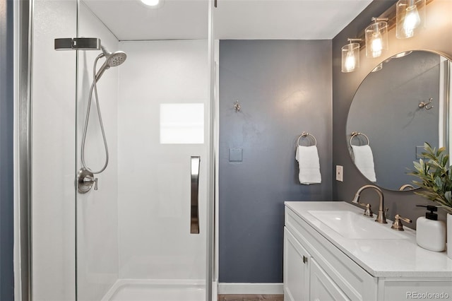 bathroom with walk in shower and vanity