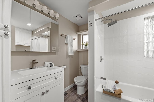 full bathroom with vanity, wood-type flooring, toilet, and shower / bath combo with shower curtain